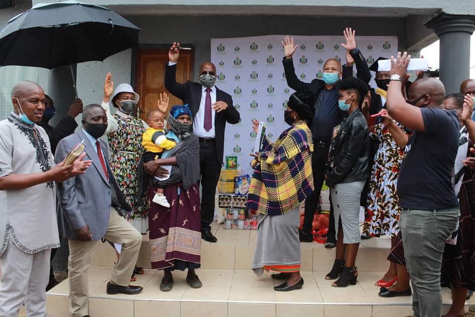 Sekhukhune District Executive Mayor Stanley Ramaila hands over a 5 room